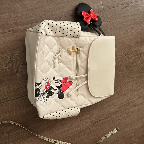 Disney Handbags - NWT Disney Cream Backpack with Minnie Mouse and Red Bow